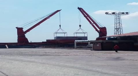 Cranes beside a barge during a lake operation